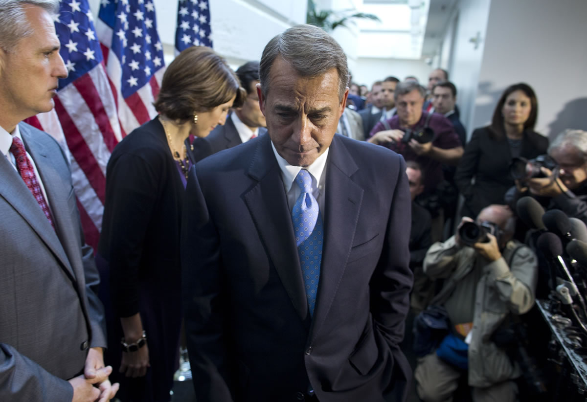 House Speaker John Boehner, R-Ohio, walks away from the microphone during a news conference after a House GOP meeting Tuesday on Capitol Hill.