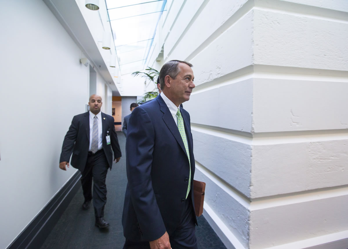 Speaker of the House John Boehner, R-Ohio, walks to a GOP caucus meeting at the Capitol on Wednesday.