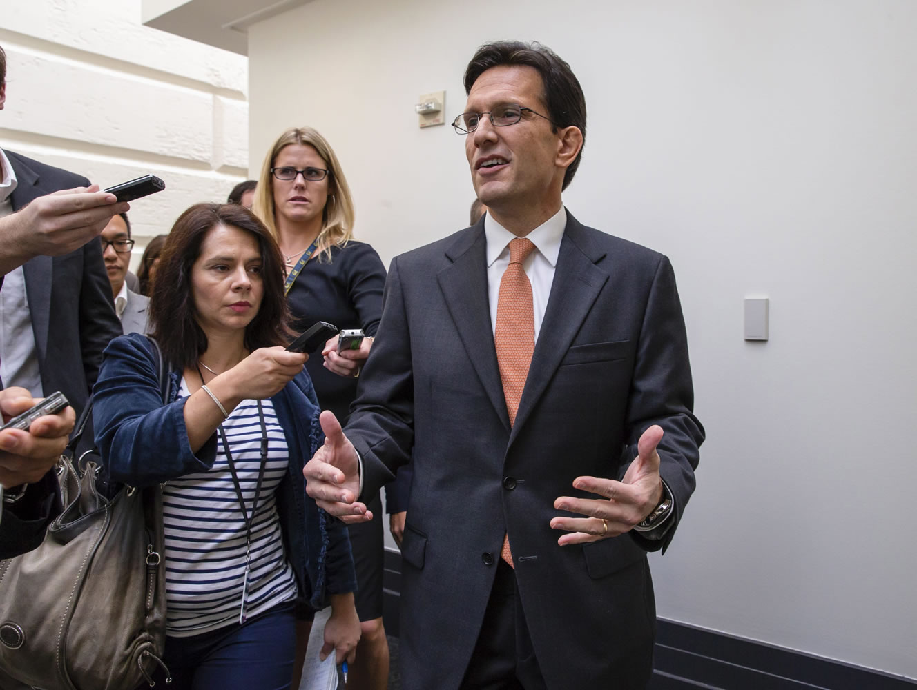 House Majority Leader Eric Cantor, R-Va., is pursued by reporters after a news conference with the GOP Doctors Caucus to talk about how the government shutdown is impacting medical research Thursday on Capitol Hill in Washington.