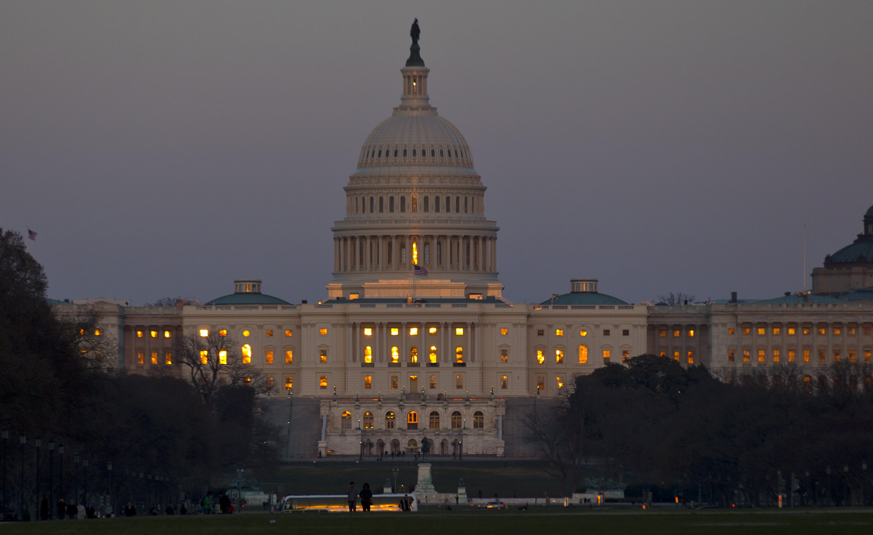 The setting sun is reflected in the windows of the U.S. Capitol in Washington on Friday.