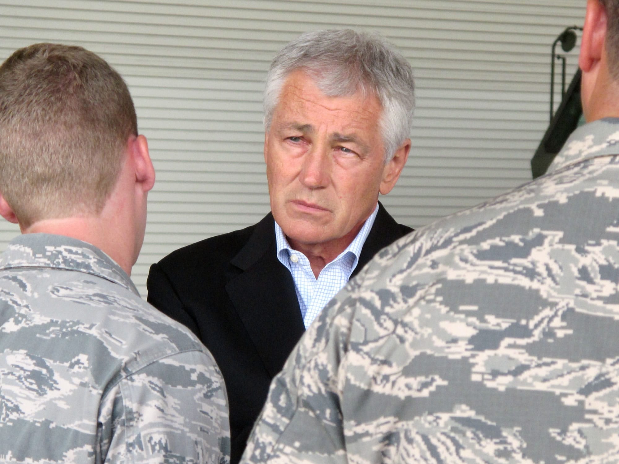 Defense Secretary Chuck Hagel talks with Air Force personnel at Joint Base Charleston near Charleston, S.C., on the last day of a three-day trip to visit bases in the Carolinas and Florida.