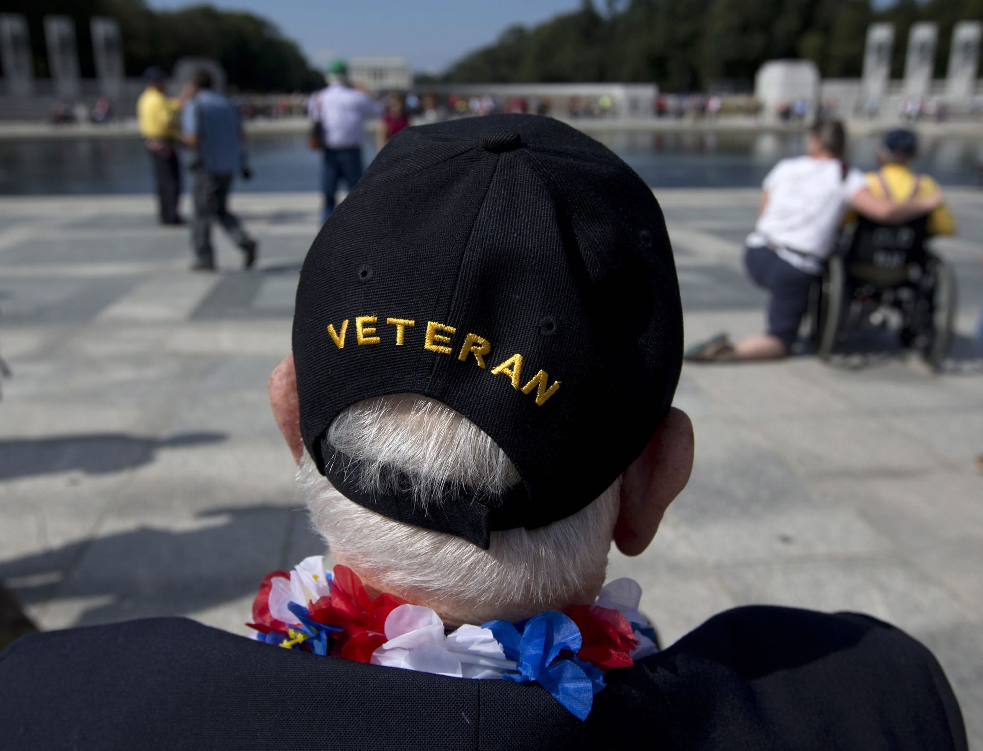 World War II Veteran George Bloss, from Gulfport, Miss., looks out over the National World War II Memorial in Washington on Tuesday. Veterans who had traveled from across the country were allowed to visit the National World War II Memorial after it had been officially closed because of the partial government shutdown.