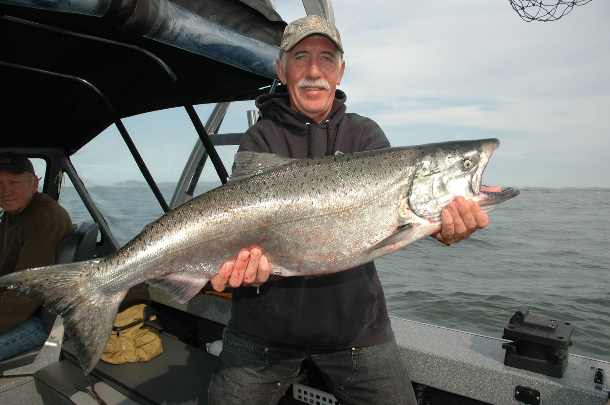 Keith Martin of Greshman with a fin-clipped chinook caught at Buoy 10.
