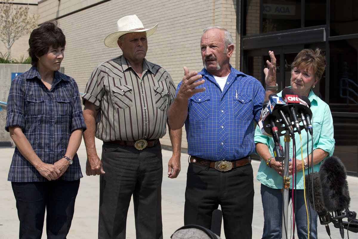Standing out in front of the Ada County Sheriff's Office in Boise, witnesses, from left to right, Mary Young, Mike Young, Mark John and Christa John speak Sunday with news reporters about their sighting of Hannah Anderson and James DiMaggio out Morehead Lake.