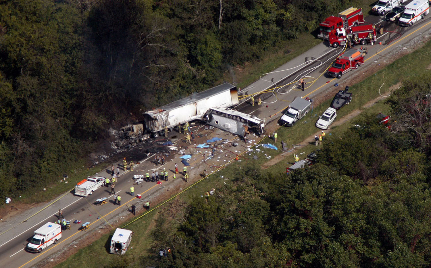 Emergency workers respond to a crash involving a church bus and a tractor-trailer near Dandridge, Tenn., on Wednesday.
