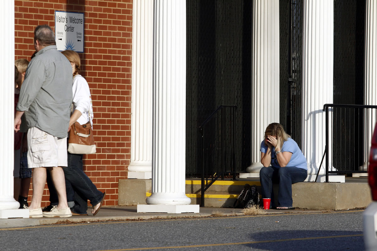 A woman sits outside of Front Street Baptist Church in Statesville, N.C.