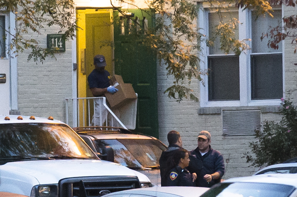 A federal agent removes evidence Friday from the apartment complex where Miriam Carey is believed to have lived in Stamford, Conn. Law-enforcement authorities have identified Carey, 34, as the woman who, with a 1-year-old child in her car, led Secret Service and police on a harrowing chase in Washington from the White House past the Capitol Thursday, attempting to penetrate the security barriers at both national landmarks before she was shot to death, police said. The child survived.
