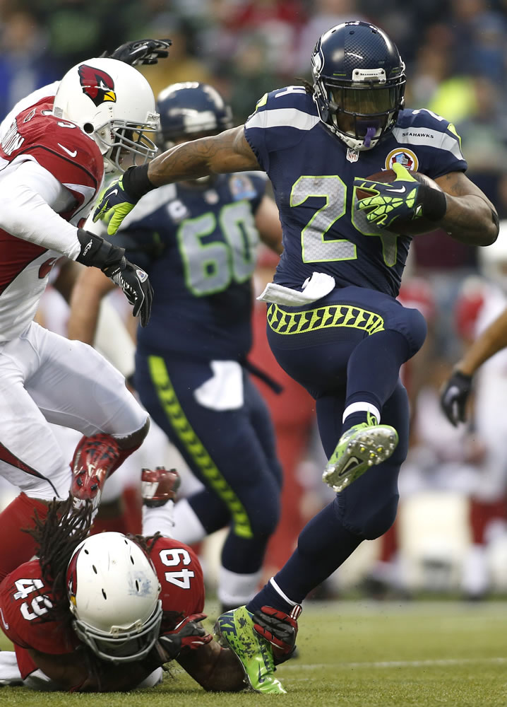 Seattle Seahawks running back Marshawn Lynch (24) runs for a 33-yard touchdown in the third quarter Sunday.