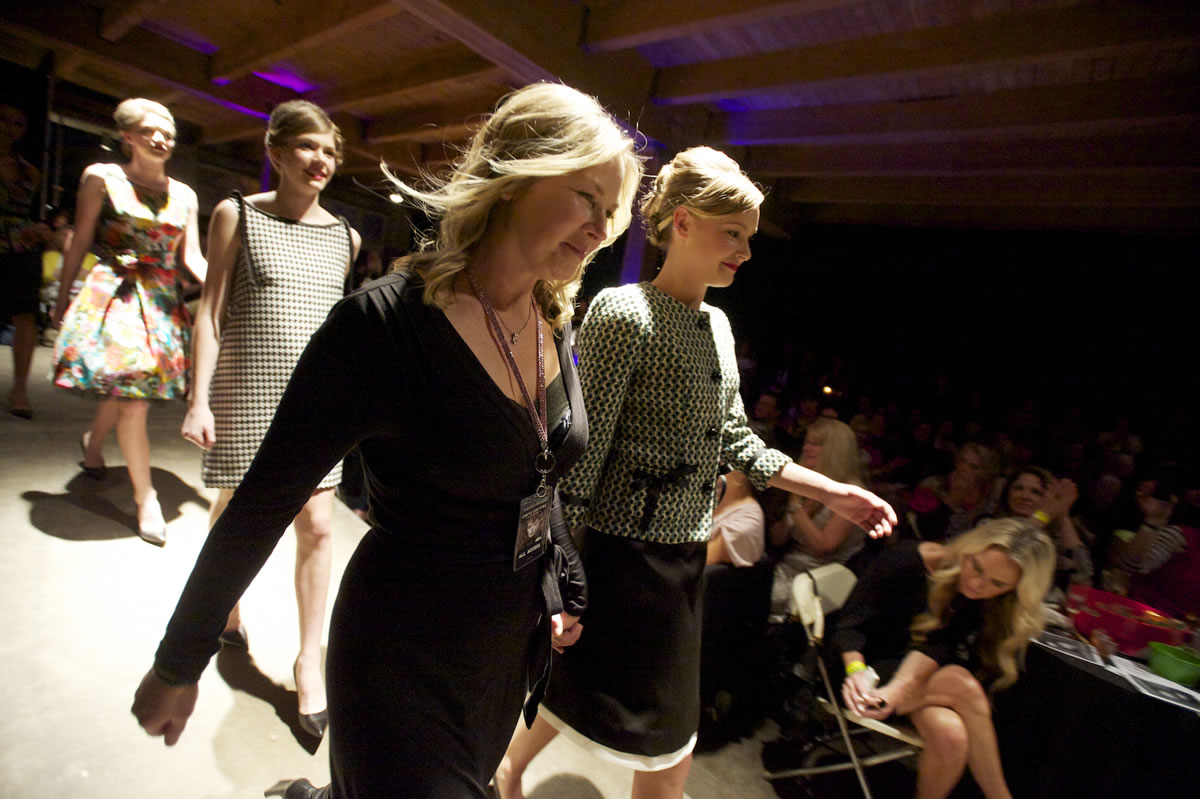 Cathy Rae Kudla walks next to her collection on the spring Couve Couture runway in April.