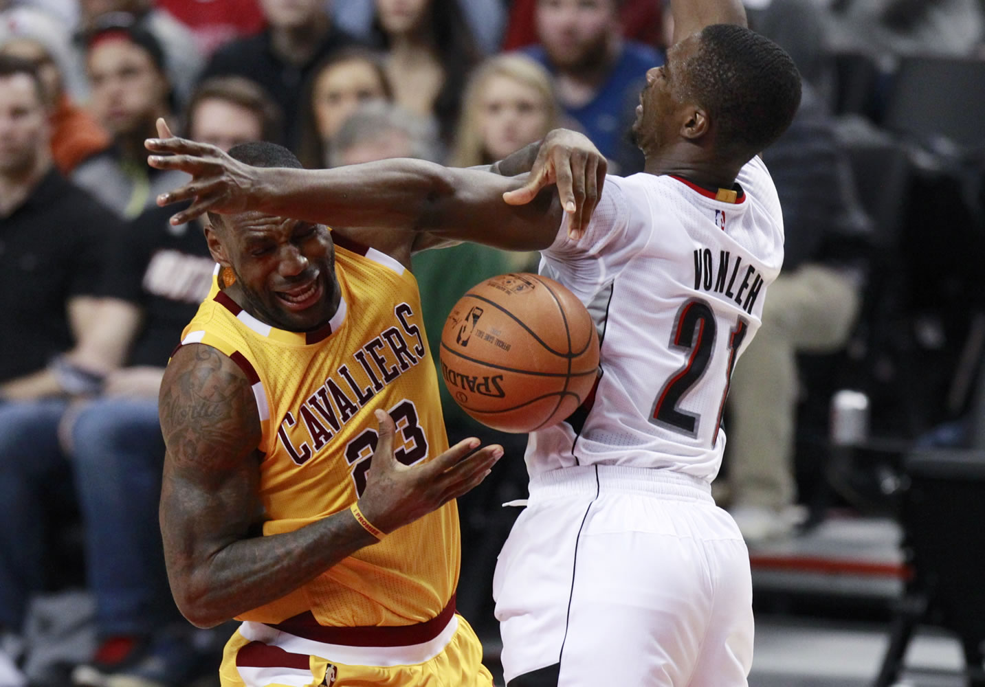Portland Trail Blazers forward Noah Vonleh (right) knocks the ball away from Cleveland Cavaliers forward LeBron James during the second half of an NBA basketball game in Portland, Ore., Saturday, Dec. 26, 2015.