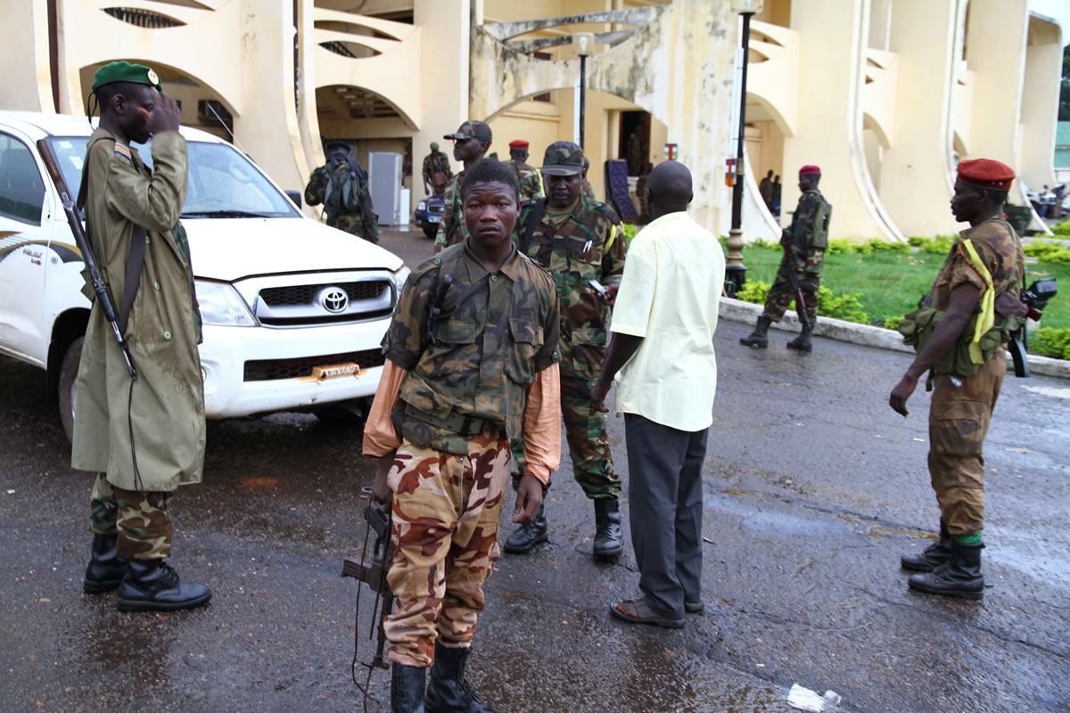 Rebel soldiers stand guard outside the presidential palace in Bangui, Central African Republic.