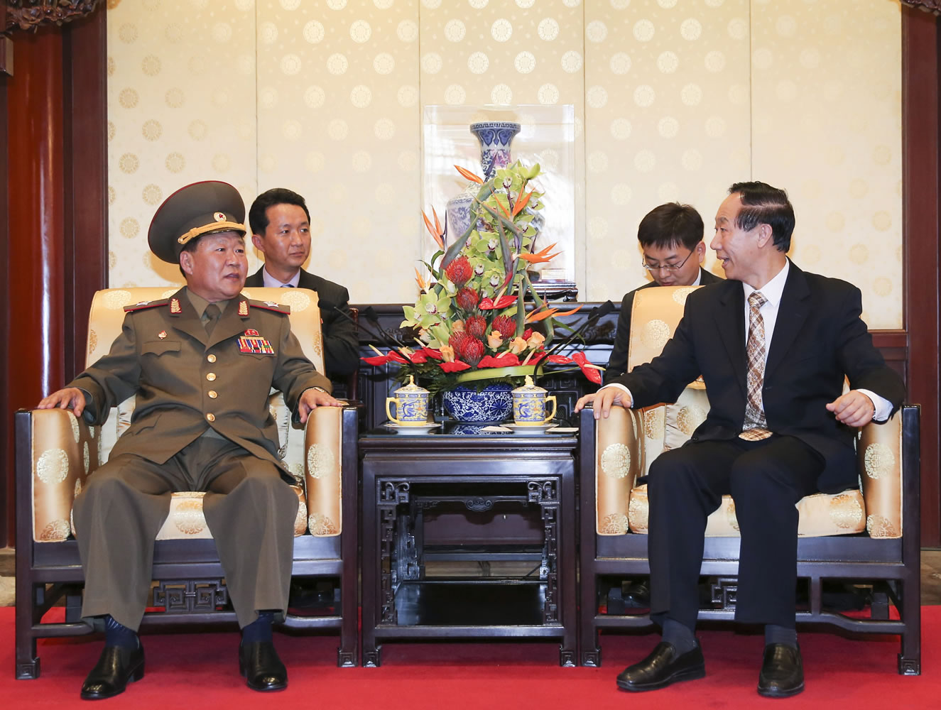 Wang Jiarui, right, the head of the Chinese leadership's international affairs office, meets with North Korea's Vice Marshal Choe Ryong Hae, a senior Workersi Party official and the military's top political officer, left, in Beijing on Wednesday.