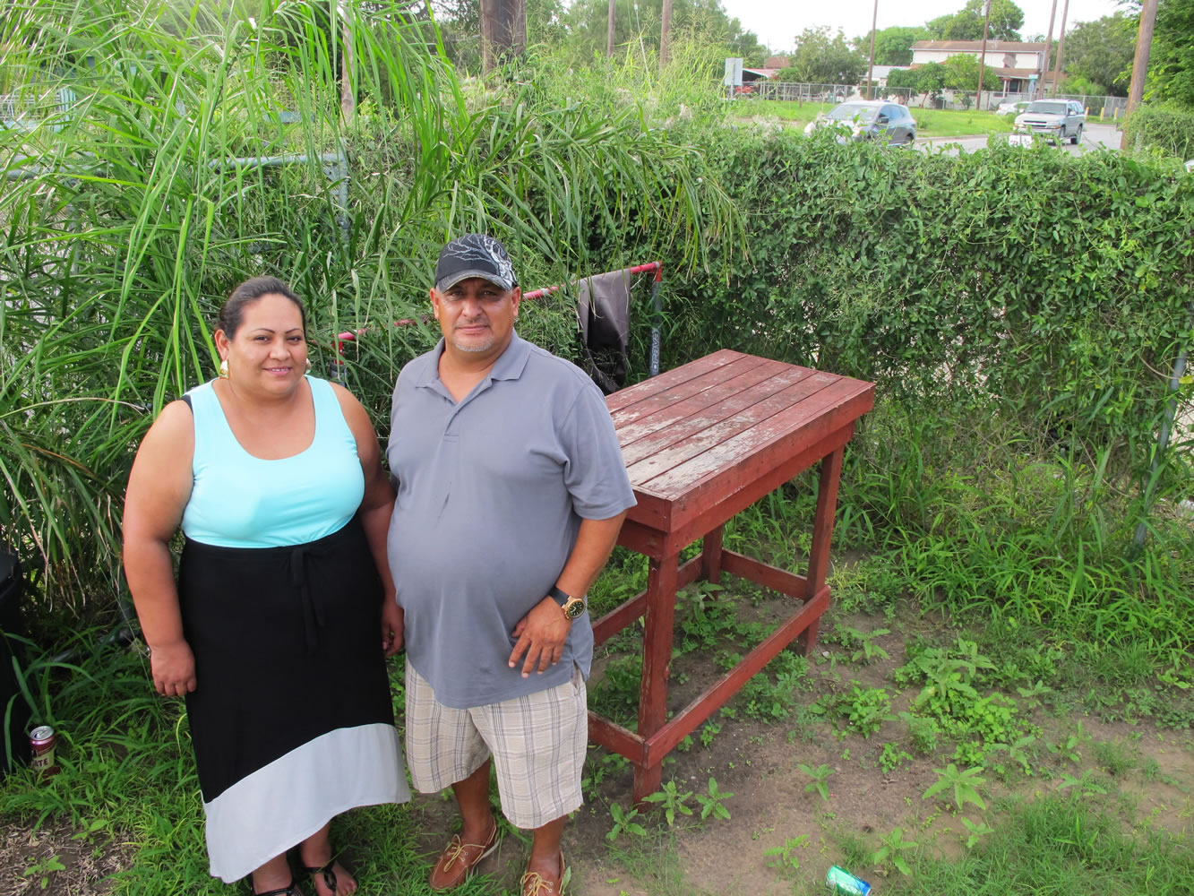 Sigifredo Saldana Iracheta, right, and his wife, Laura Saldana, pose for a photo outside his sister's home in Brownsville, Texas.