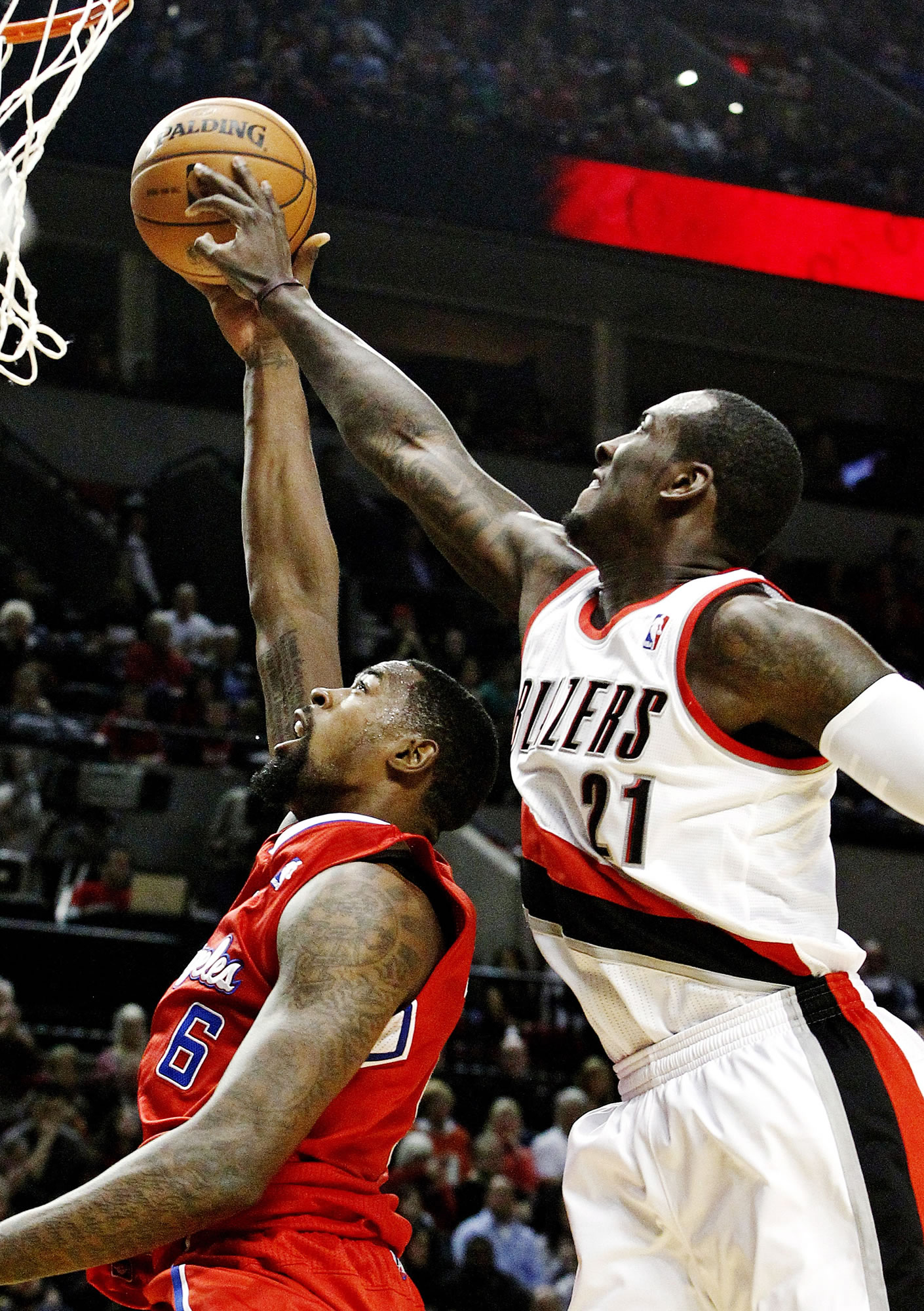 Trail Blazers center J.J. Hickson blocks a shot from the Clippers' DeAndre Jordan, but Portland couldn't muster enough defense to pull out a comeback victory.