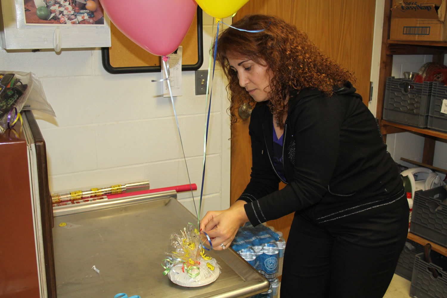 Connecticut College
Lina Hajj, a dining services staff member, assembles a birthday bash care package that parents can order online for pick-up by their kids on campus.