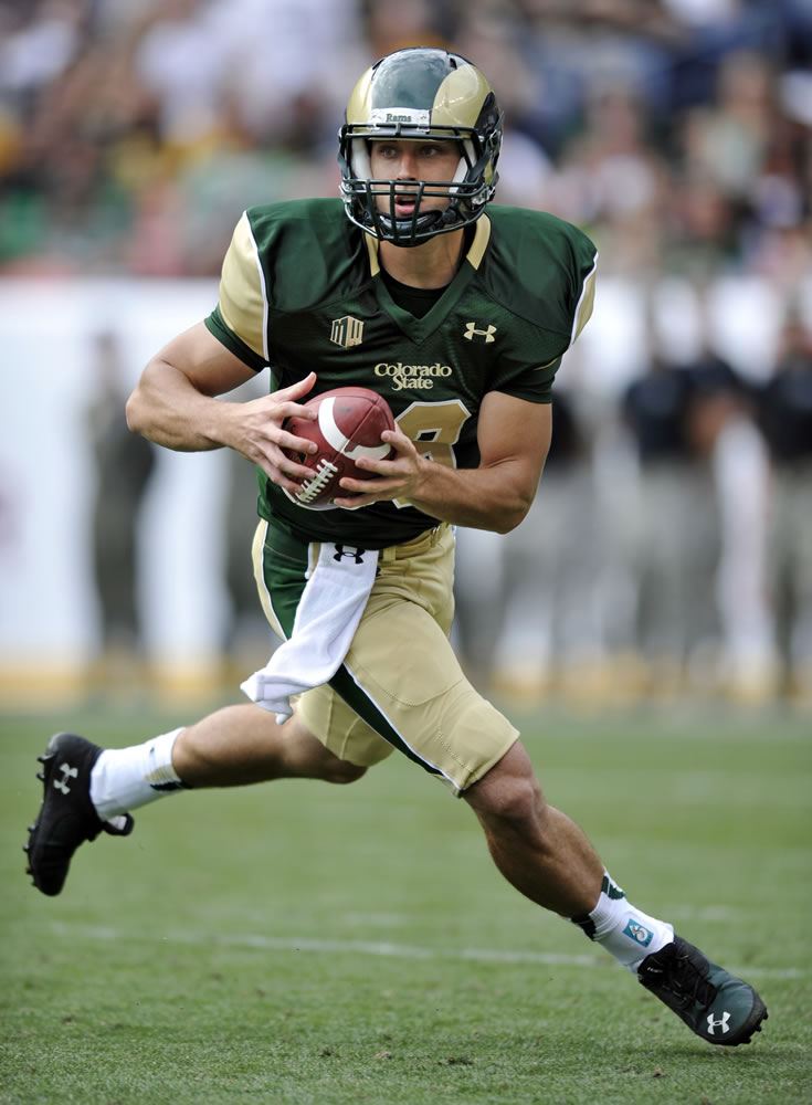 Colorado State quarterback Garrett Grayson, a Heritage High grad, rolls out against Colorado during the first half Sunday. Named the starter just before game time, Grayson completed 22 of 39 passes for 201 yards.