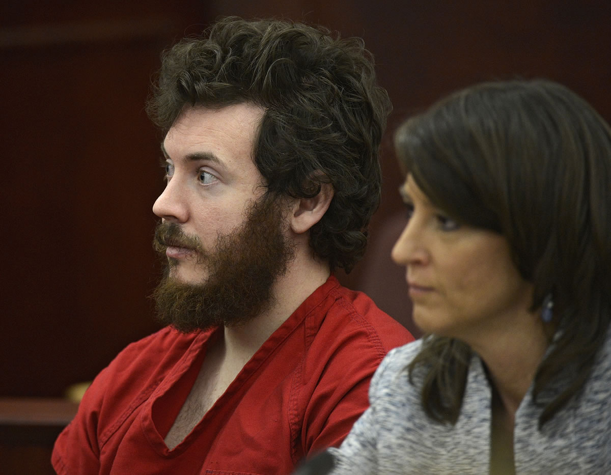 James Holmes, left, and defense attorney Tamara Brady appear in district court in Centennial, Colo., in March for his arraignment.
