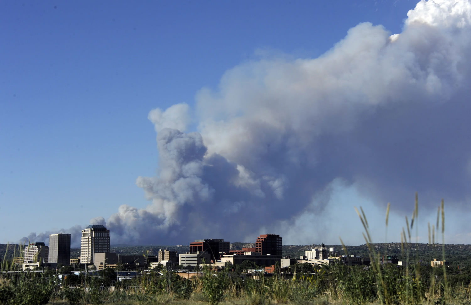 Smoke from the Black Forest fire billows north of downtown Colorado Springs, Colo. on Tuesday.