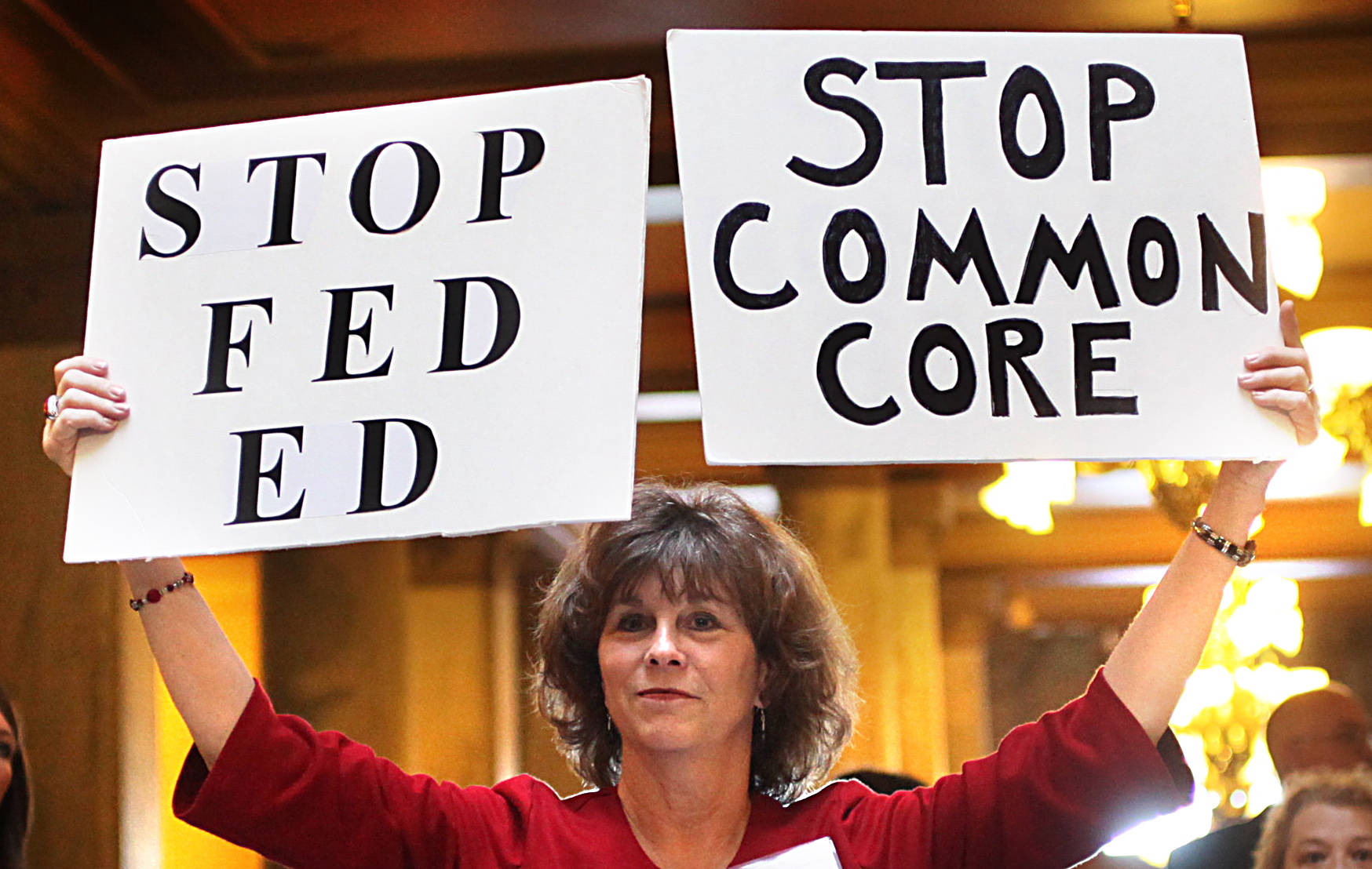 Concerned grandparent Sue Lile, of Carmel, Ind., shows her opposition to Common Core standards during a January rally at the State House rotunda in Indianapolis.