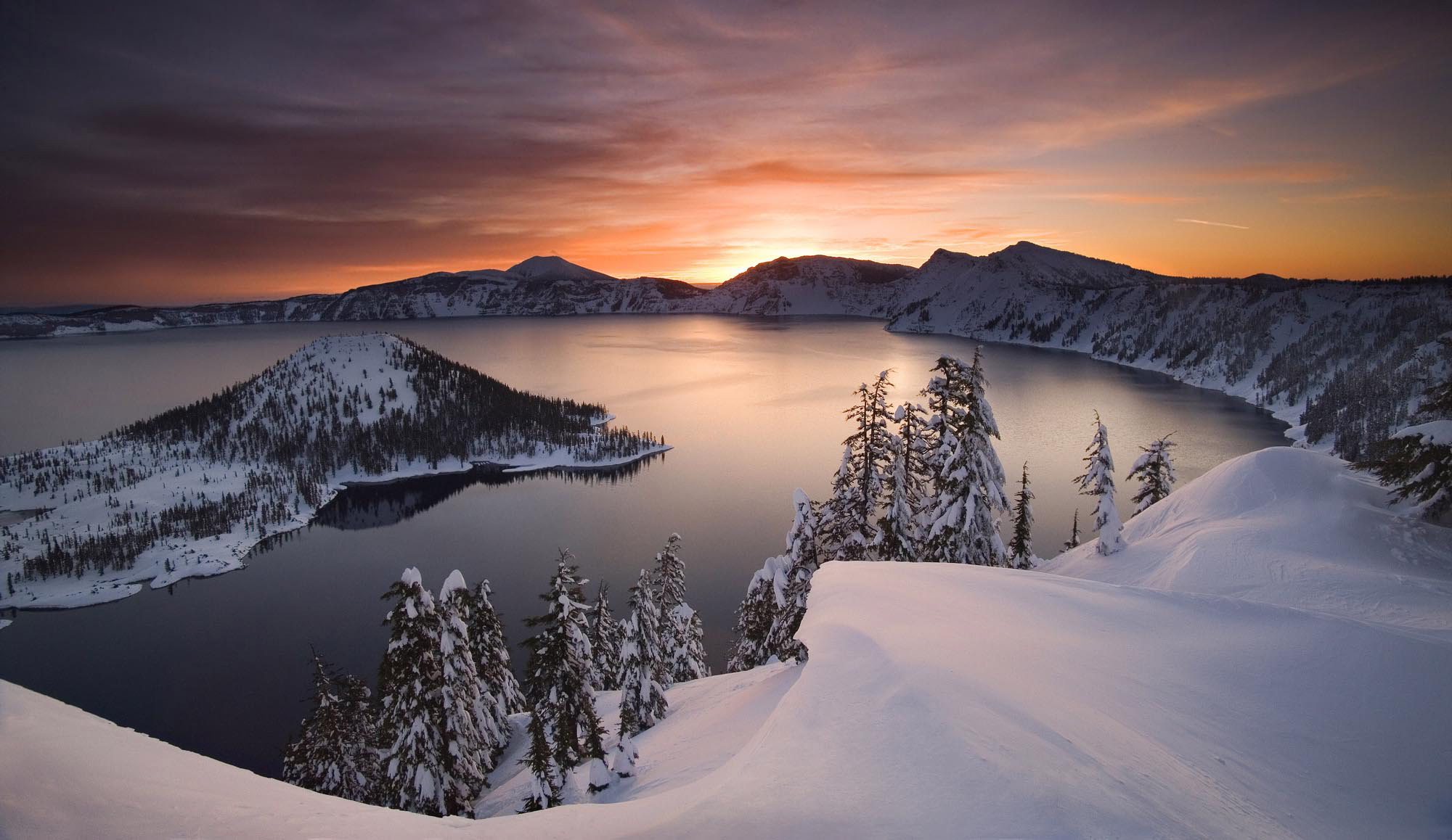 The sun rises over Crater Lake, Ore., in January 2006.