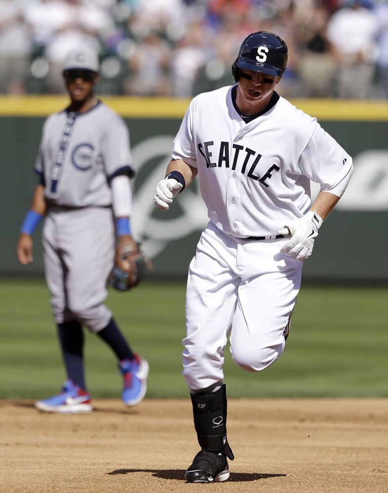 Seattle Mariners' Justin Smoak and Chicago Cubs shortstop Starlin Castro in Turn-Back-The-Clock uniforms.