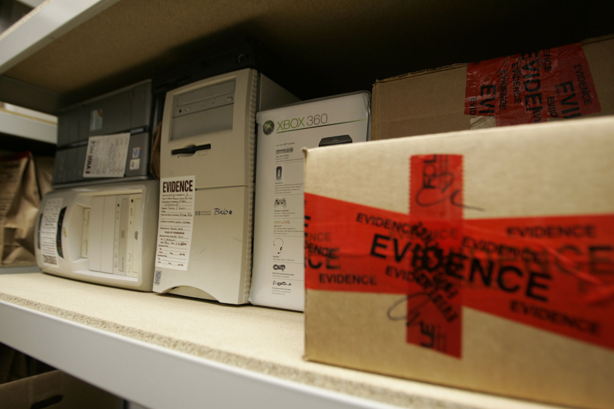 Confiscated computers and child-oriented pornographic tapes fill the storeroom shelves in the Florida Attorney General's Child Predator CyberCrime Unit office in Jacksonville, Fla.