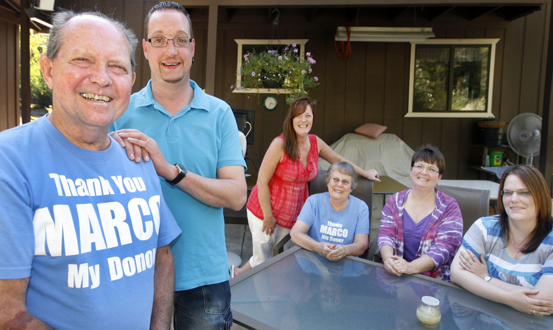 Jerry Condit, left, stands next to Marco Rixen, who lives in Germany, at Condit's home in Grants Pass, Ore. Condit's family -- from left, daughter Kimberly Condit-Stutesman; wife, Jan; and daughter Michelle Condit-McBride -- and Rixen's wife, Anja, far right, look on Sept. 19.
