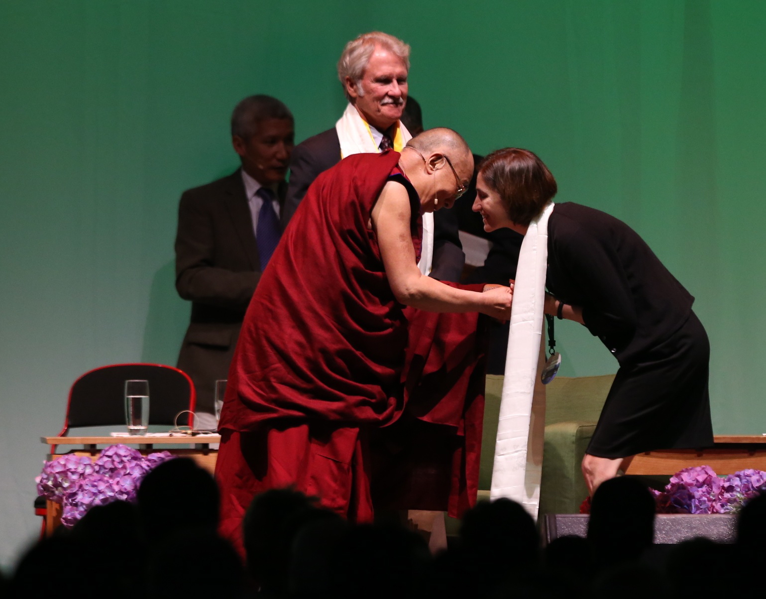 The Dalai Lama presents a welcome scarf to Andrea Durbin, executive director of the Oregon Environmental Council, during His Holiness the Dalai Lama Environmental Summit on &quot;Universal Responsibility and the Global Environment&quot; at Veterans Memorial Coliseum, Saturday in Portland.