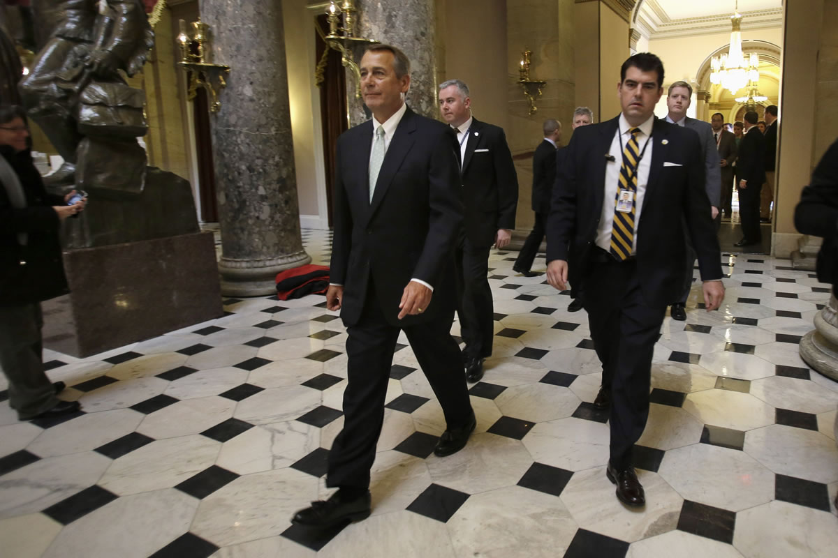 House Speaker John Boehner of Ohio leaves a news conference on the debt limit on Capitol Hill in Washington on Wednesday.