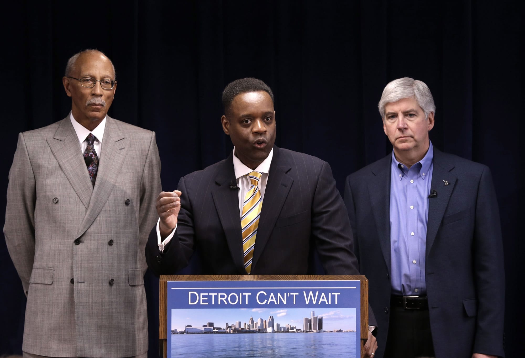 Kevyn Orr, center, speaks at a news conference as Detroit Mayor Dave Bing, left, and Gov. Rick Snyder listen in Detroit on Thursday. Snyder announced that he had chosen Orr, a partner in the Cleveland-based law and restructuring Jones Day firm, as Detroit's emergency manager.