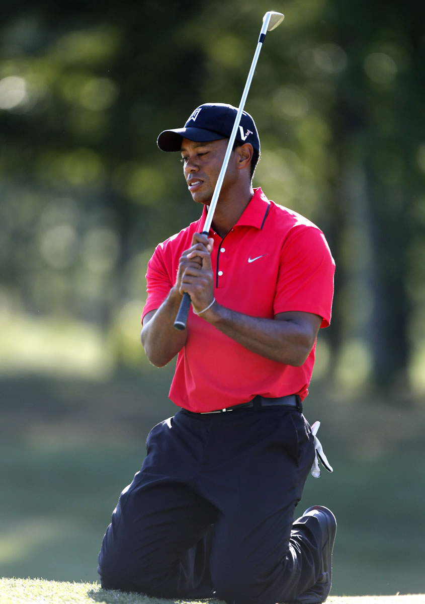 The Associated Press
Tiger Woods did not earn first-place money Monday, but he hit a milestone.