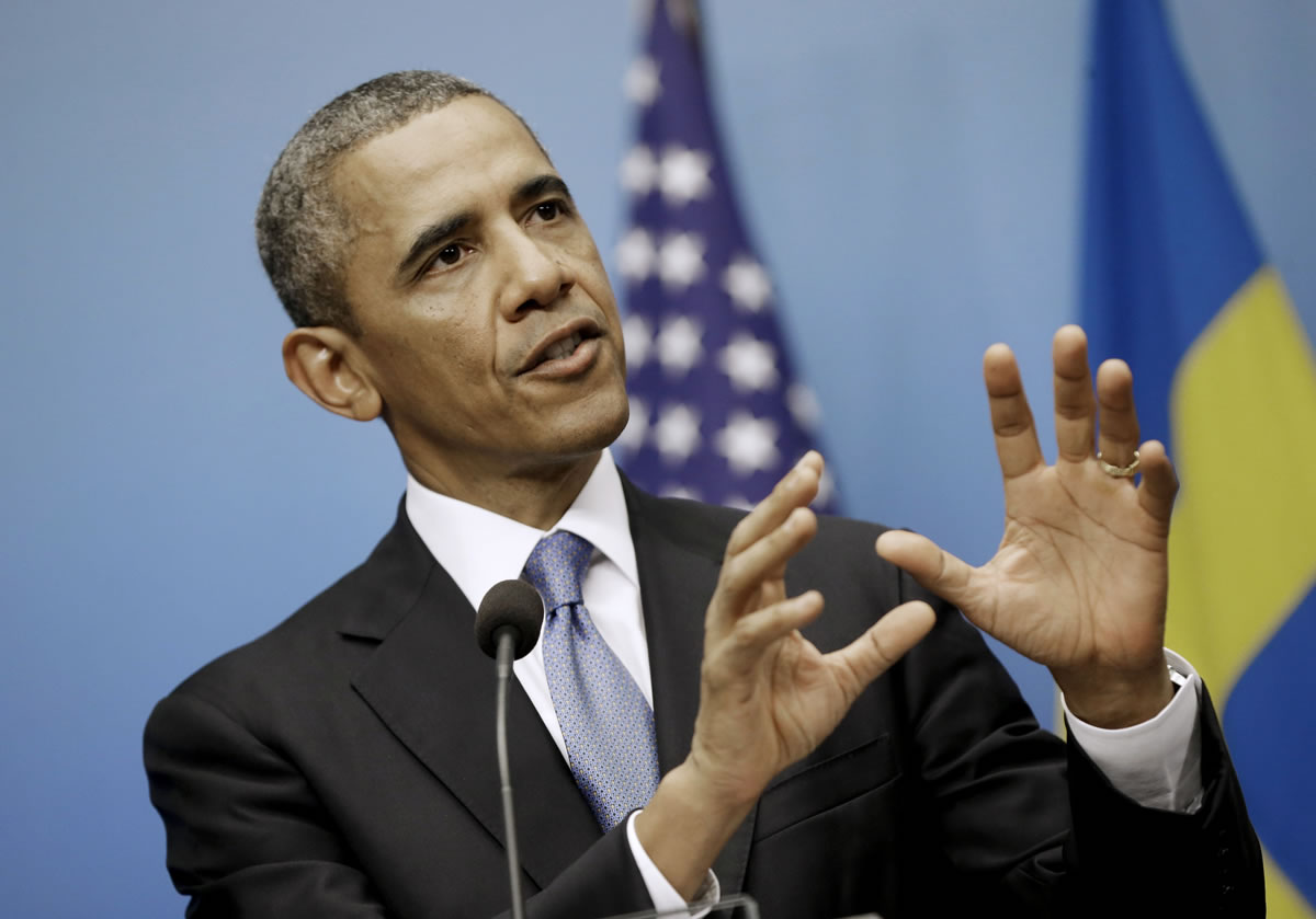 President Barack Obama gestures as he answers questions during a joint news conference with Swedish Prime Minister Fredrik Reinfeldt on Wednesday at the Rosenbad Building in Stockholm, Sweden.