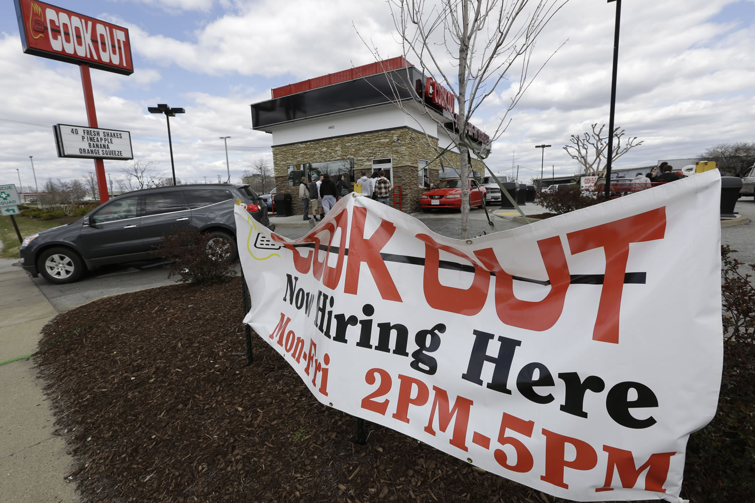 A help-wanted sign hangs in front of a restaurant in Richmond, Va., on March 29. The U.S.