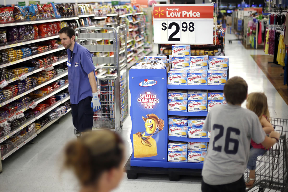 Shoppers peruse the aisles at a Walmart in Bristol, Pa.
