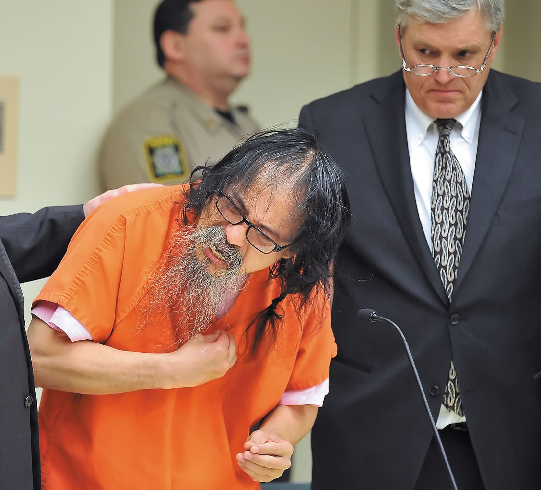 Jordan Adam Criado, 52, expresses himself while entering an Alford plea to four counts of aggravated murder and one of arson in Jackson County Circuit Court on Tuesday in Medford, Ore. Criado admitted that he killed his wife in July 2011, but blamed her for the deaths of their four children.