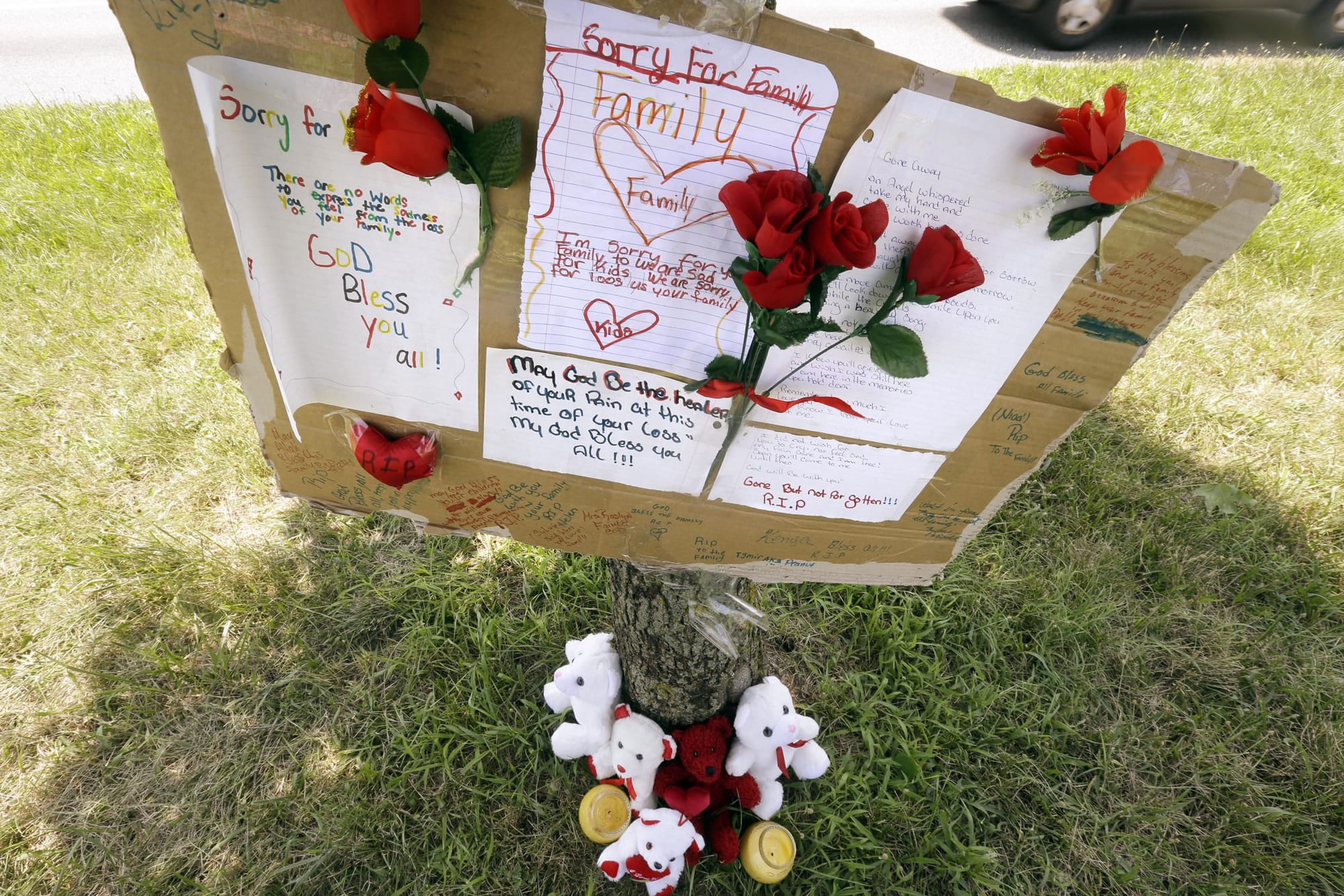 A makeshift memorial is shown near the location where a mother and three young sons were struck and killed while trying to cross a busy highway after dark Wednesday in Philadelphia.
