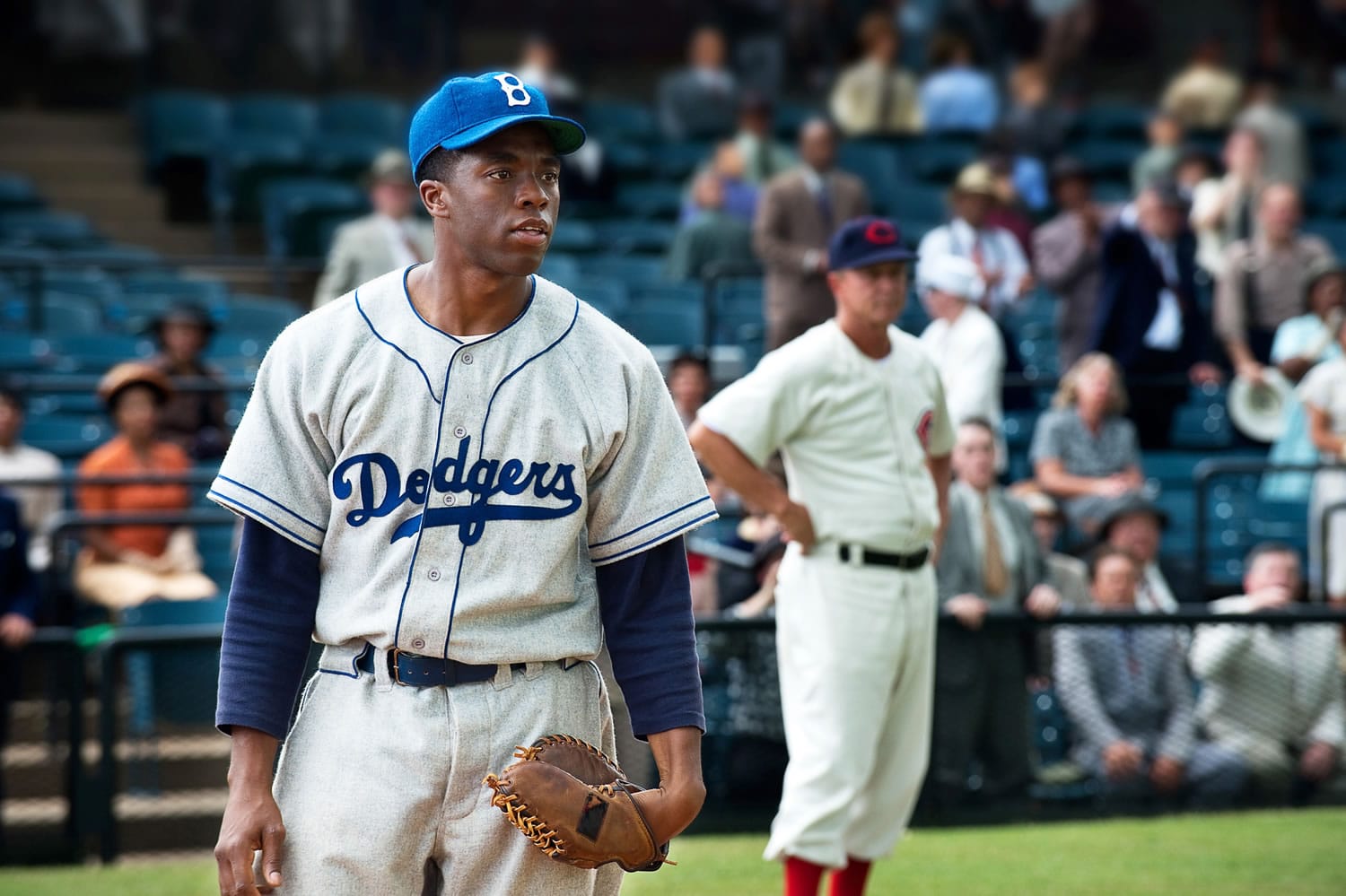 Chadwick Boseman portrays Jackie Robinson in a scene from &quot;42,&quot; by writer-director Brian Helgeland. Remembering Robinson's accomplishments is more important than ever, say people involved with &quot;42&quot; and baseball historians alike.