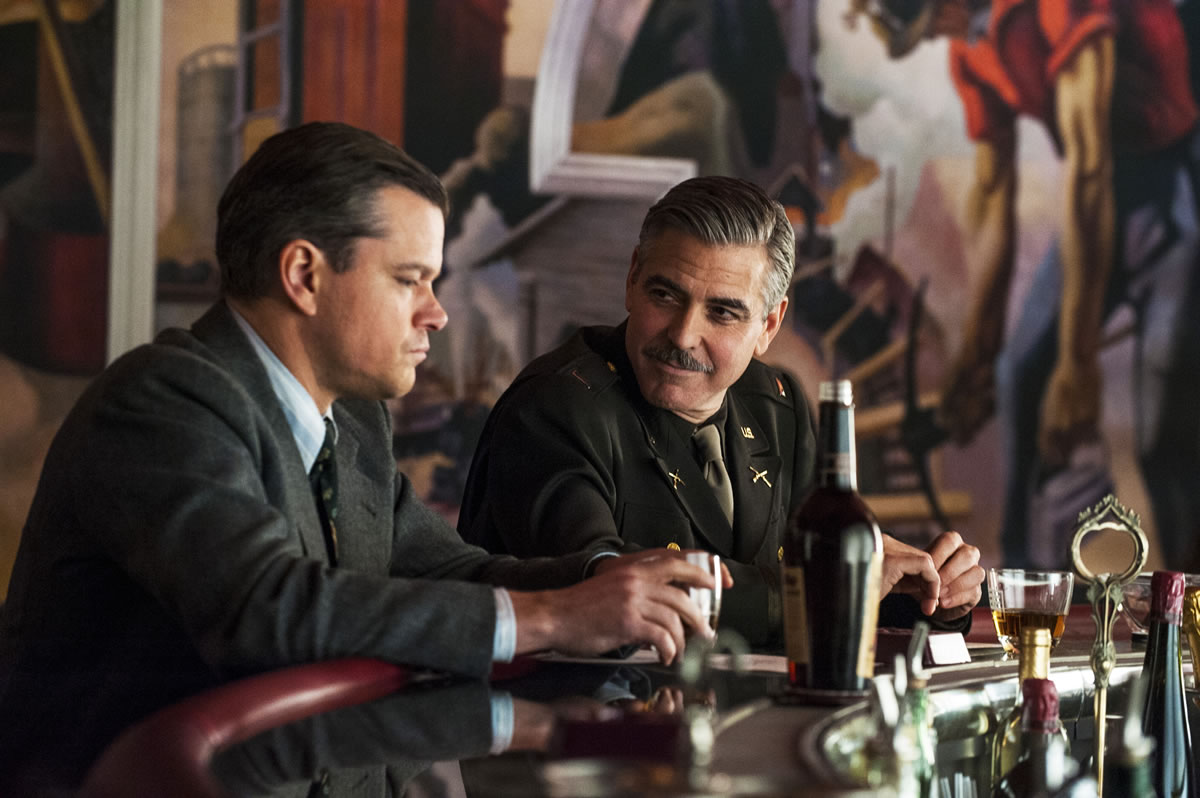 Matt Damon, left, and George Clooney in &quot;The Monuments Men.&quot; A spokesman for Sony Pictures said Wednesday that the film will now be released in the first quarter of next year, instead of its planned release date of Dec.