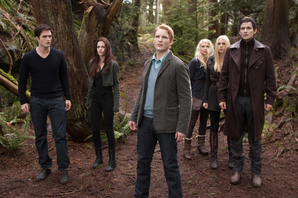 Robert Pattinson, from left, Kristen Stewart, Peter Facinelli, MyAnna Buring, Casey LaBow and Christian Camargo in a scene from &quot;The Twilight Saga: Breaking Dawn Part 2.&quot;