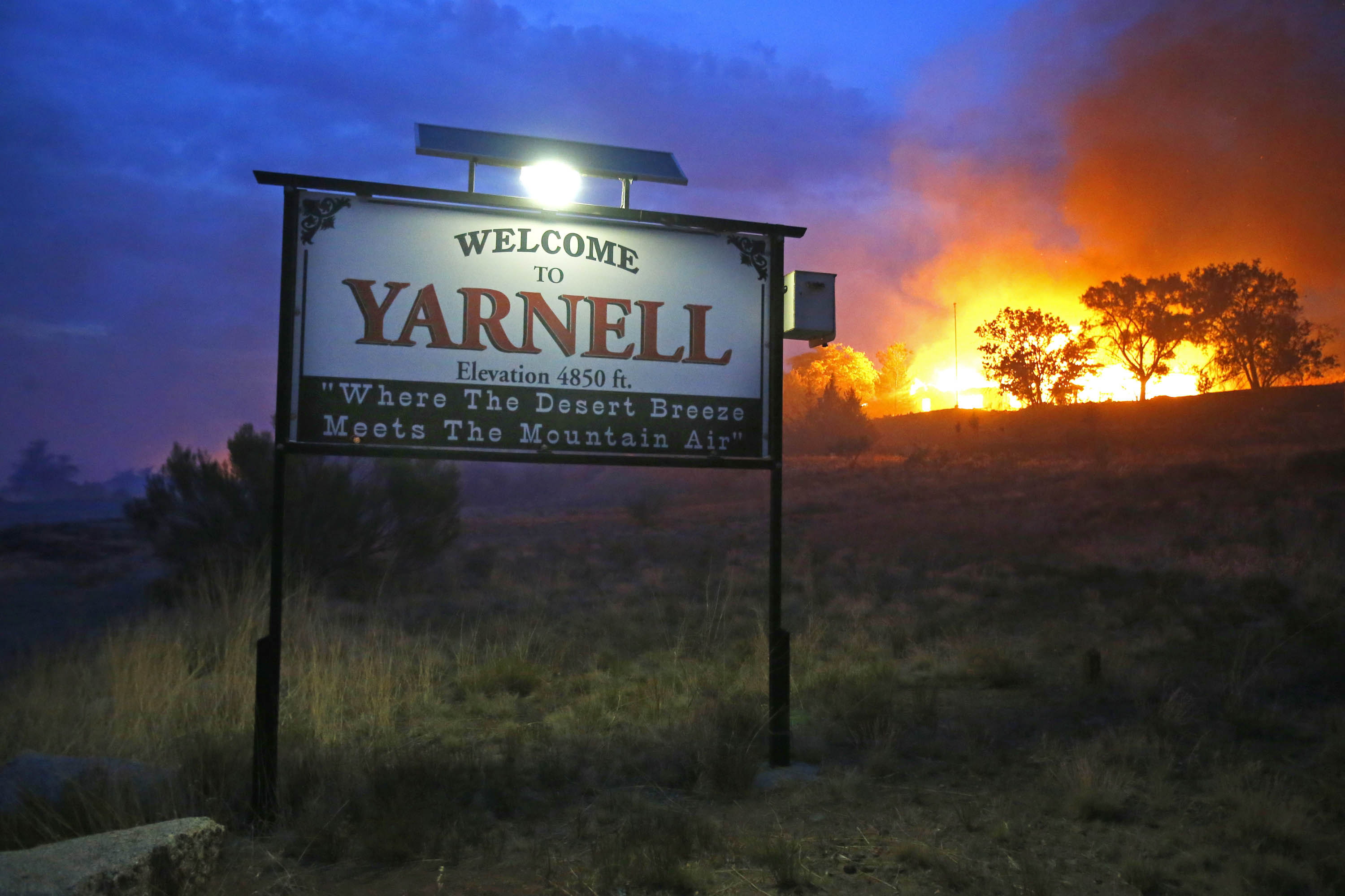 The deadly wildfire burns homes June 30 in Yarnell, Ariz.