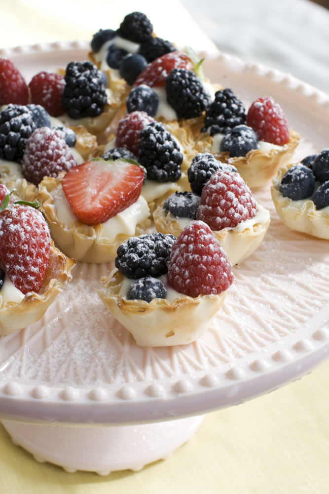 Creamy Lemon-Berry Tartlets are so simple that you could even delegate this part of the meal to the kids.