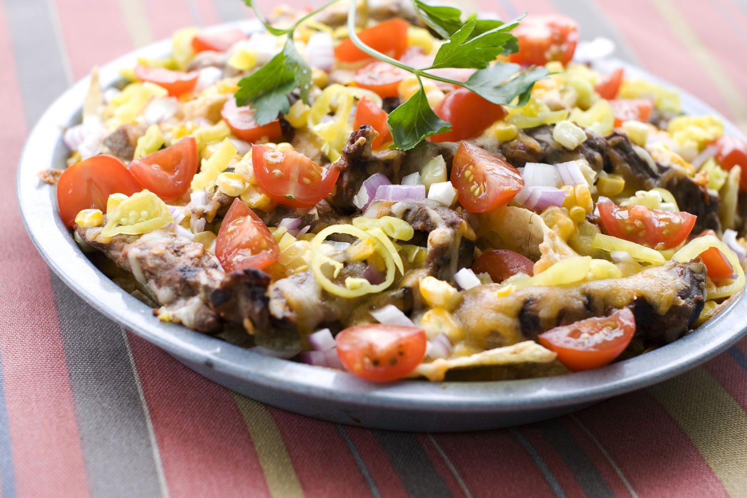 Corn and Steak Grilled Nachos is the next evolution of the layered Mexican dish.