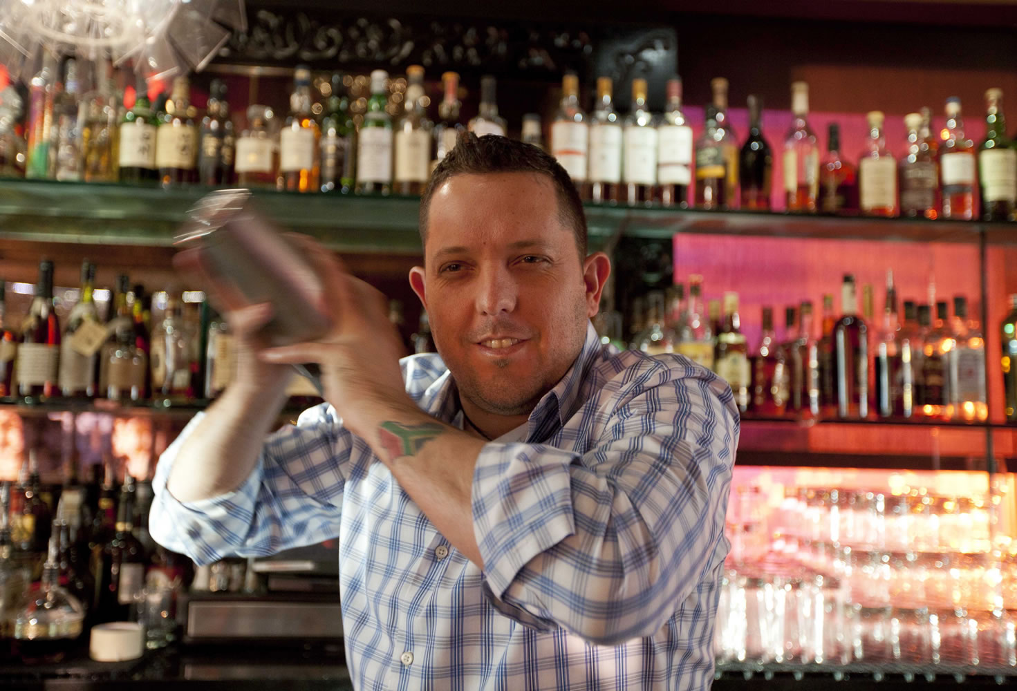 Mixologist Jacques Bezuidenhout prepares a gin Martini cocktail in the Starlight Room of the Sir Francis Drake Hotel in San Francisco.