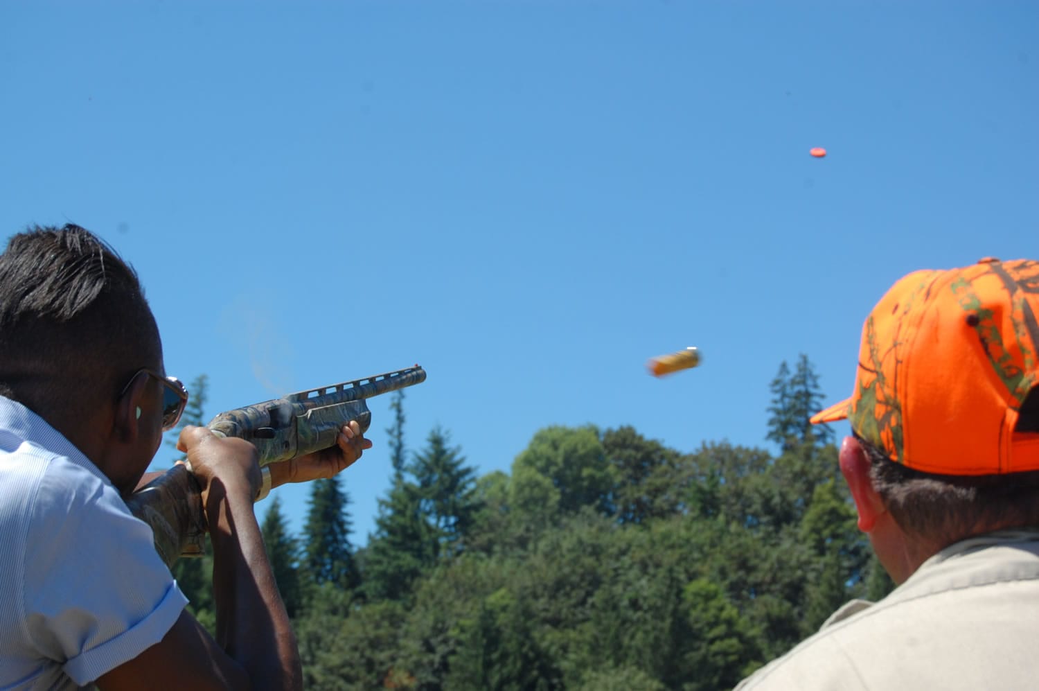 Chef Gregory Gourdet of Portland restaurant Departure fires a .20-gauge shotgun during firearms training June 29 near Canby, Ore.