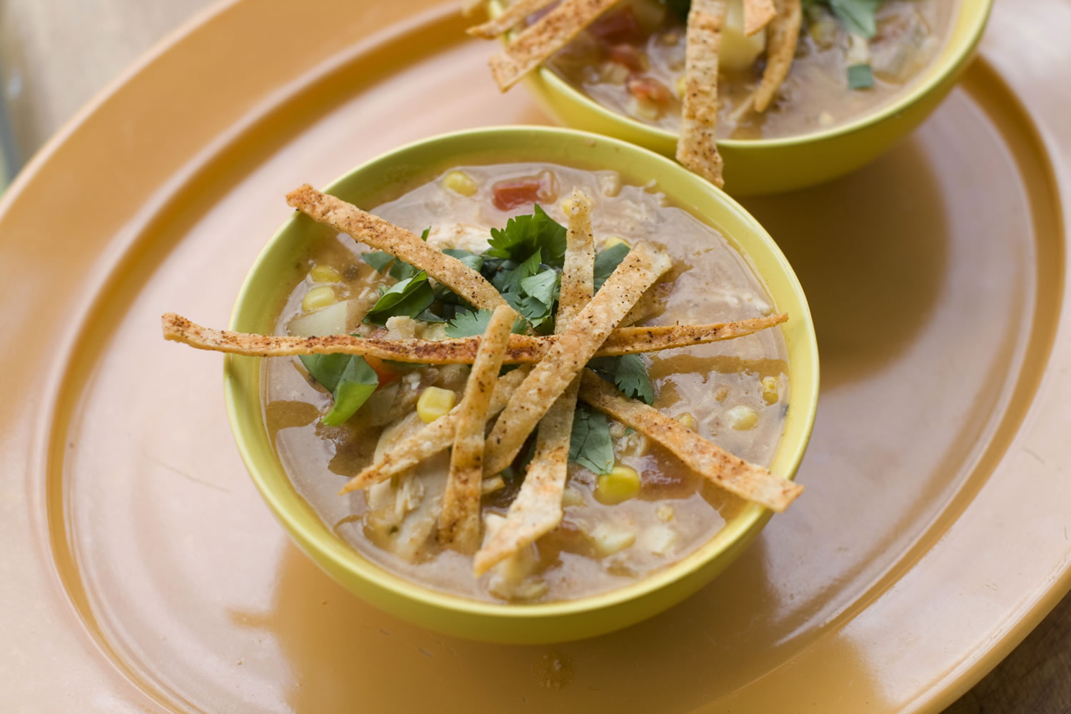 Bowls Of Southwestern Corn and Chicken Chowder with Tortilla Crisps
