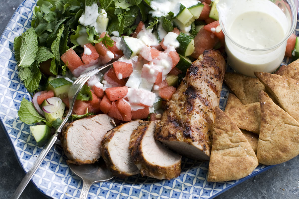 Grilled Pork Tenderloin with Watermelon-Arugula Salad  showcases a magical pairing of fruit and cheese.