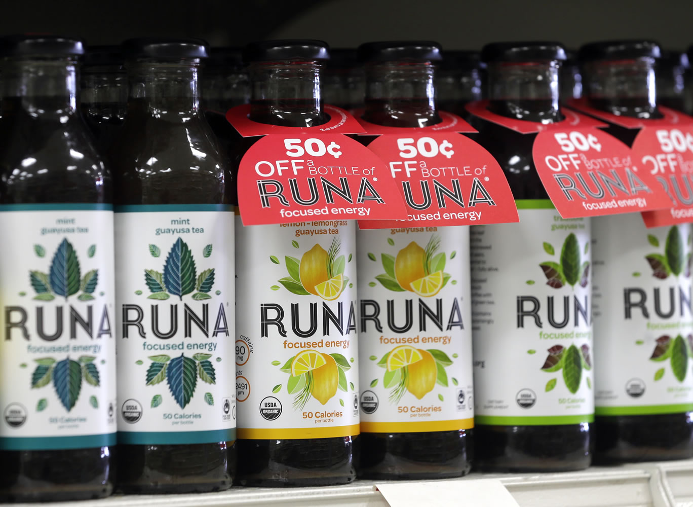 Bottles of Runa energy drinks line a shelf at Dean's Natural Foods store in Albany, N.Y.