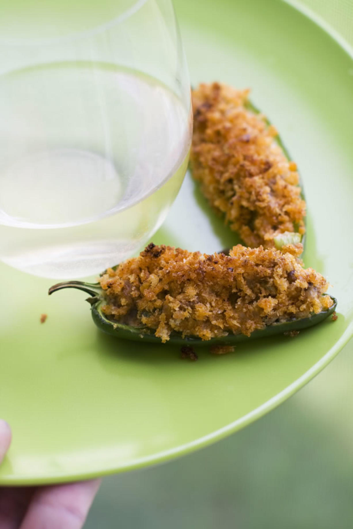 Cheesy sausage-stuffed jalapeno peppers make a great side to a grilled entree or a snack while watching sports.
