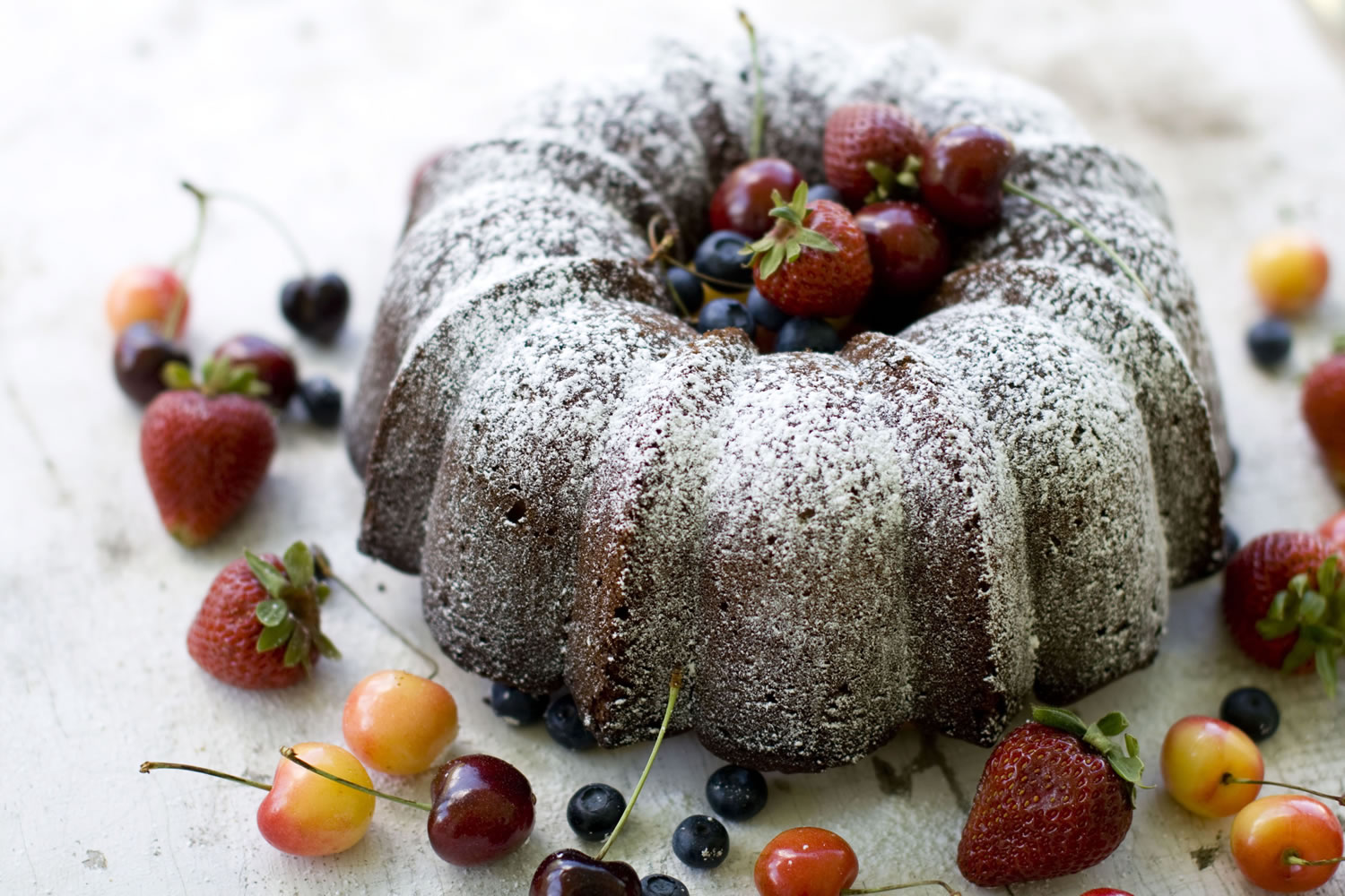 Economy Pound Cake is served with blueberries, cherries and strawberries.