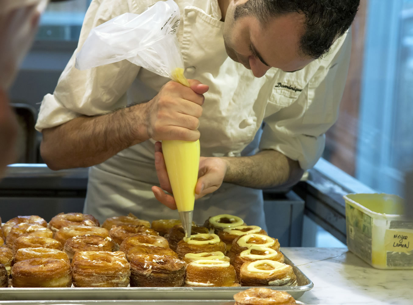 Chef Dominique Ansel makes Cronuts, a croissant-doughnut hybrid, at the Dominique Ansel Bakery in New York.